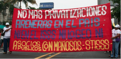 Salvadoran electrical and municipal workers union leaders will tour the U.S. in February, asking allies to oppose the latest U.S.-backed privatization push in their country. "No to Public Partnerships With Thieves!" read one banner at a May Day protest last year. Photo: CISPES.