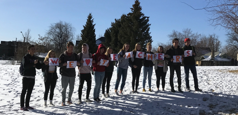 Denver students held signs spelling out "We heart teachers."