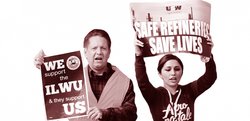 Two workers holding up signs.