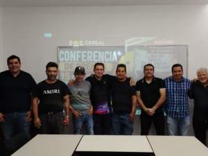Former Honda workers gather for a photo at a press conference. 