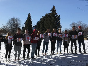 Denver students held signs spelling out "We heart teachers." 