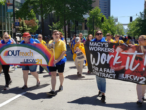 Macy's workers marching for their workplace rights during Seattle's Pride Parade.