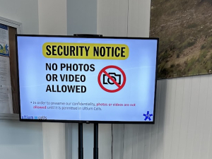 A screen at an Ultium Cells facility which says, "Security Notice: No Photos or Videos Allowed."