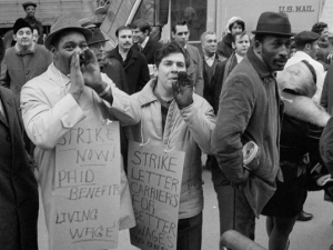 Postal strike 1970, men standing front of a mail truck