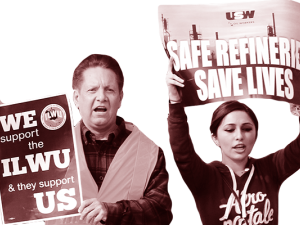 Two workers holding up signs.