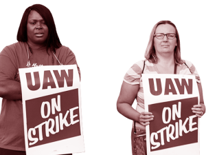 Two UAW workers with picket signs