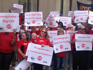 VA AFGE protesters assembled in red with signs