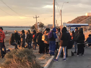 Chubut workers gathering by the side of the road.