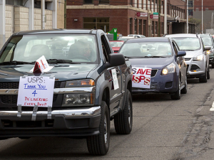 caravan of cars to support USPS in Detroit