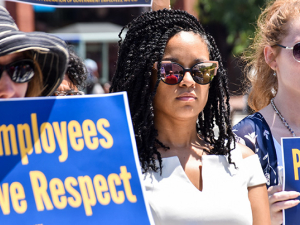 Three EPA workers protesting with signs: EPA workers demand respect. Other sign cut off.