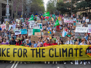 huge crowd of people, front row carries "global strike for the climate" banner