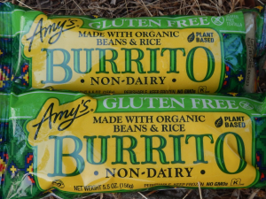 Two frozen burritos in Amy's Kitchen packaging