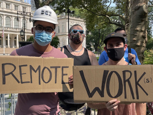 two protesters holding signs