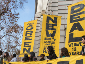 Green New Deal banners at rally