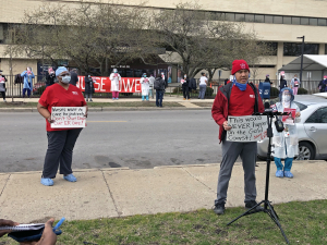 Nurses hold signs and demonstrate outside of Provident Hospital in Chicago.