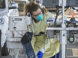 Nurses performing drive-thru tests for COVID-19 at Beaumont Hospital in Royal Oak, Michigan.