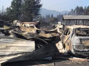 building and vehicle totally destroyed by fire