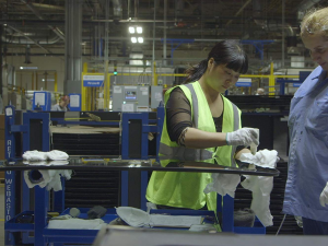 Two workers at work from the documentary American Factory