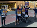 four protesters hold signs: "PROTECT VETERANS AND VA STAFF #VACOVID" AND "NAGE SEIU"