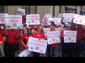 VA AFGE protesters assembled in red with signs