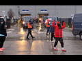 Amazon workers picketing in the parking lot of their warehouse.