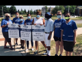 Nurses hold picket signs that read "AMITA: Calls Us Heroes, Treats Us Like Zeroes," in front of St. Joseph Hospital.