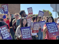 Students and faculty members rally holding signs that say "Union Busting Is Not a Jesuit Value" and "LMU: Back to the Table Now."