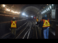 New York City transit workers working in a subway tunnel in 2017.