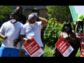 Four city workers and supporters rallying to link police brutality and the conditions that city workers face from their bosses.