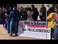 Supporters of Prop 15 tabling for the measure with a big sign.