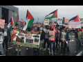 Block the Boat NY/NJ protesters with Palestinian flags at the port near Elizabeth, NJ.