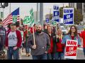 Workers on the GM picket lines with signs.