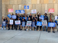 Workers gather at an APWU action
