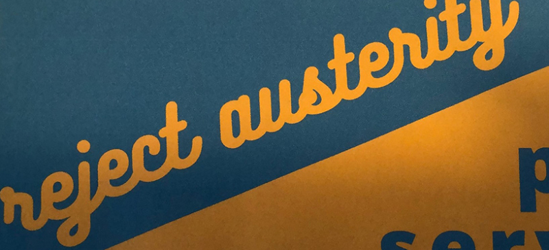 "reject austerity" in cursive