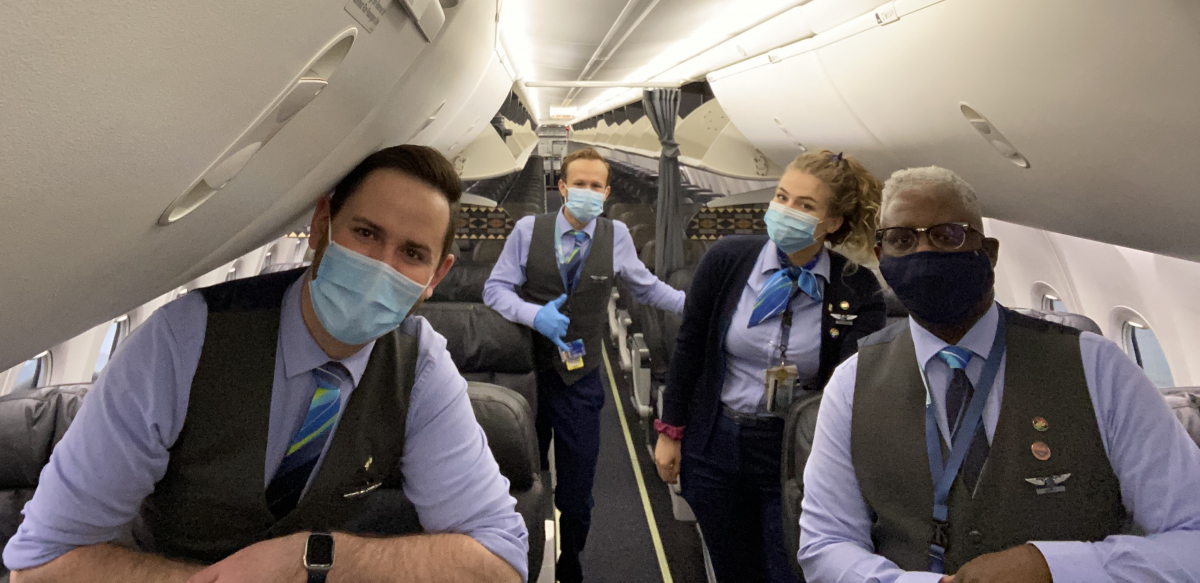 Four Association of Flight Attendants members wear masks on an Alaska Airlines flight.