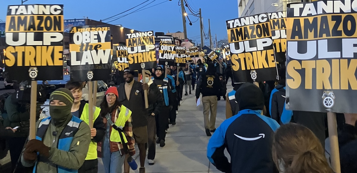 Two lines of striking Amazon workers picket.