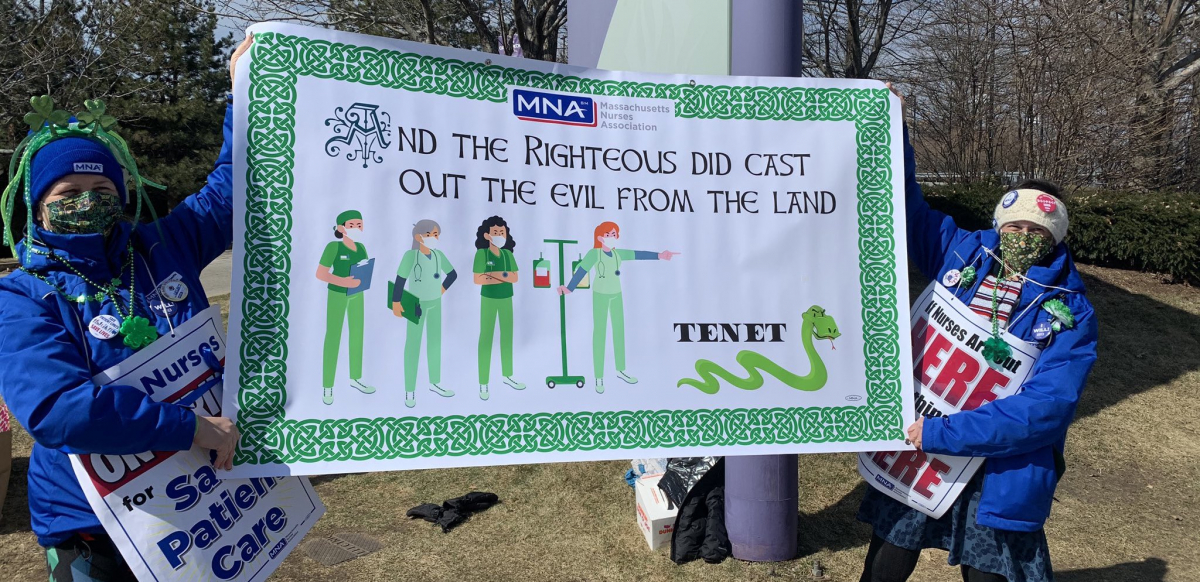 Two nurses hold a green St. Patrick's Day banner that reads "And the righteous did cast out the evil from the land." The banner pictures a group of nurses chasing off a snake labeled Tenet.