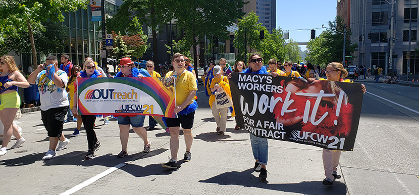 Macy's workers marching for their workplace rights during Seattle's Pride Parade.