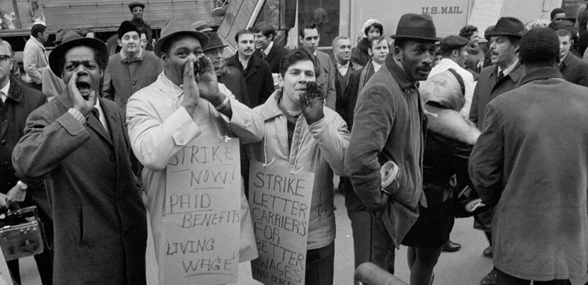 Postal strike 1970, men standing front of a mail truck
