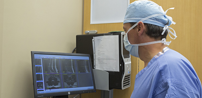 Doctor views imaging machine