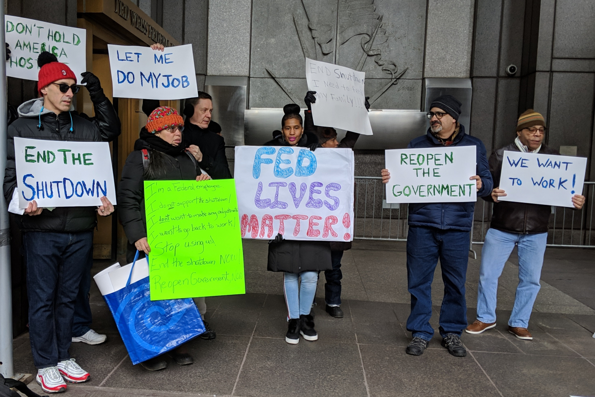 Federal government employees and their supporters rally on January 10, 2019, in front of a federal building in New York to protest the government shutdown.