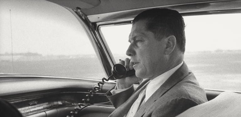 The late Teamsters president Jimmy Hoffa talking on the phone in a car.