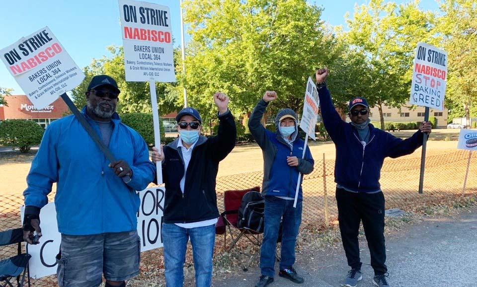Several Nabisco picketers with signs outside in Portland, Oregon.