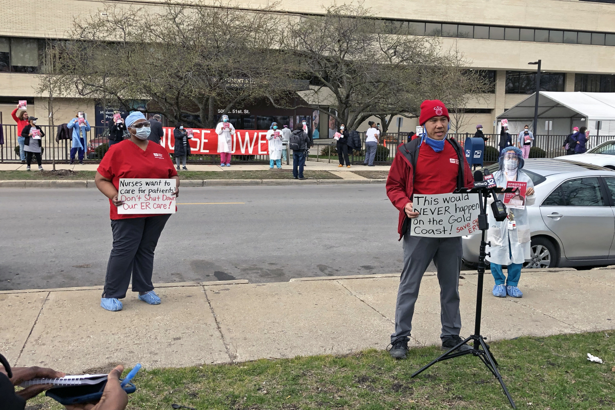 Nurses hold signs and demonstrate outside of Provident Hospital in Chicago.