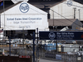 Two large white barn-shaped buildings with the U.S. Steel logo are shown.