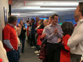 Corridor of shame pressure tactic in hallway at Reuterss - workers gathered along hallway.