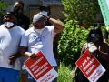 Four city workers and supporters rallying to link police brutality and the conditions that city workers face from their bosses.