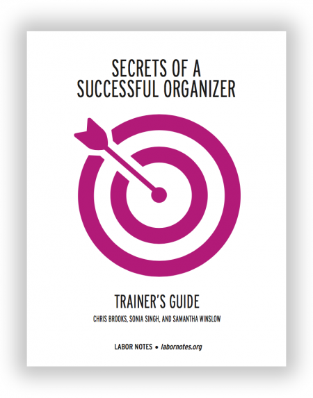 Cover of Secrets Trainers' Guide: magenta bullseye target on white background